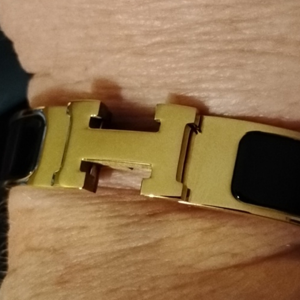 Hermes Elegant Gold and Black Bracelet